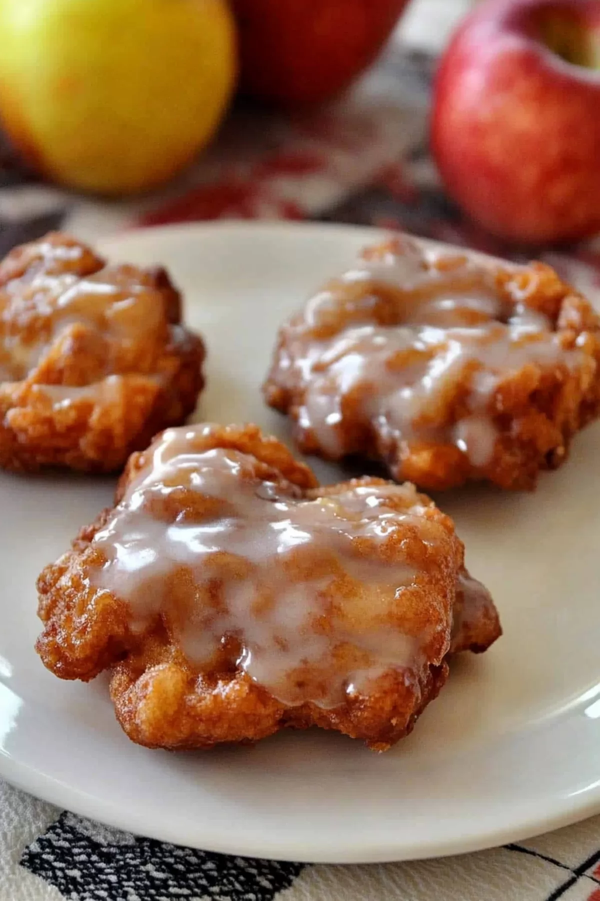 A warm and crispy fritter with a sugary glaze, highlighting its rich texture.