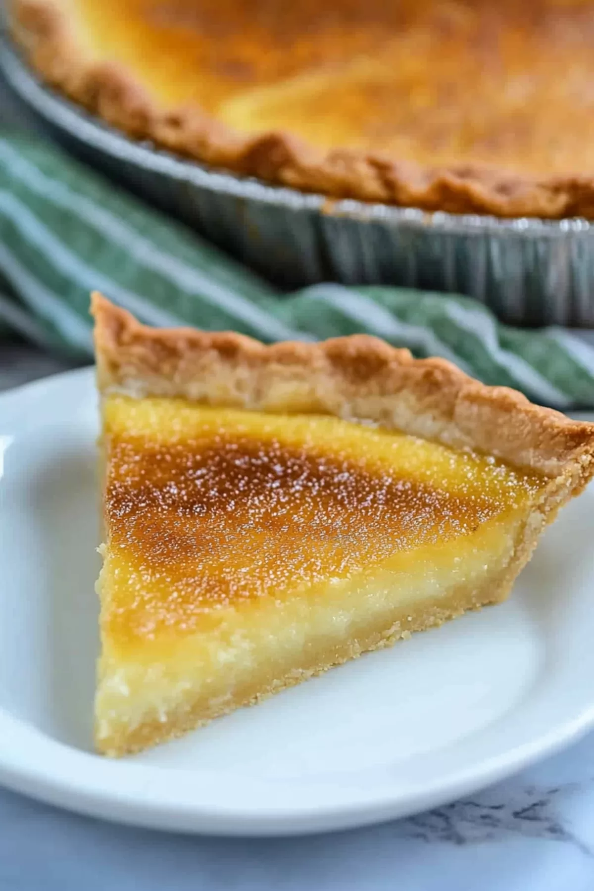 Close-up of a perfectly baked pie with a caramelized top and buttery filling.