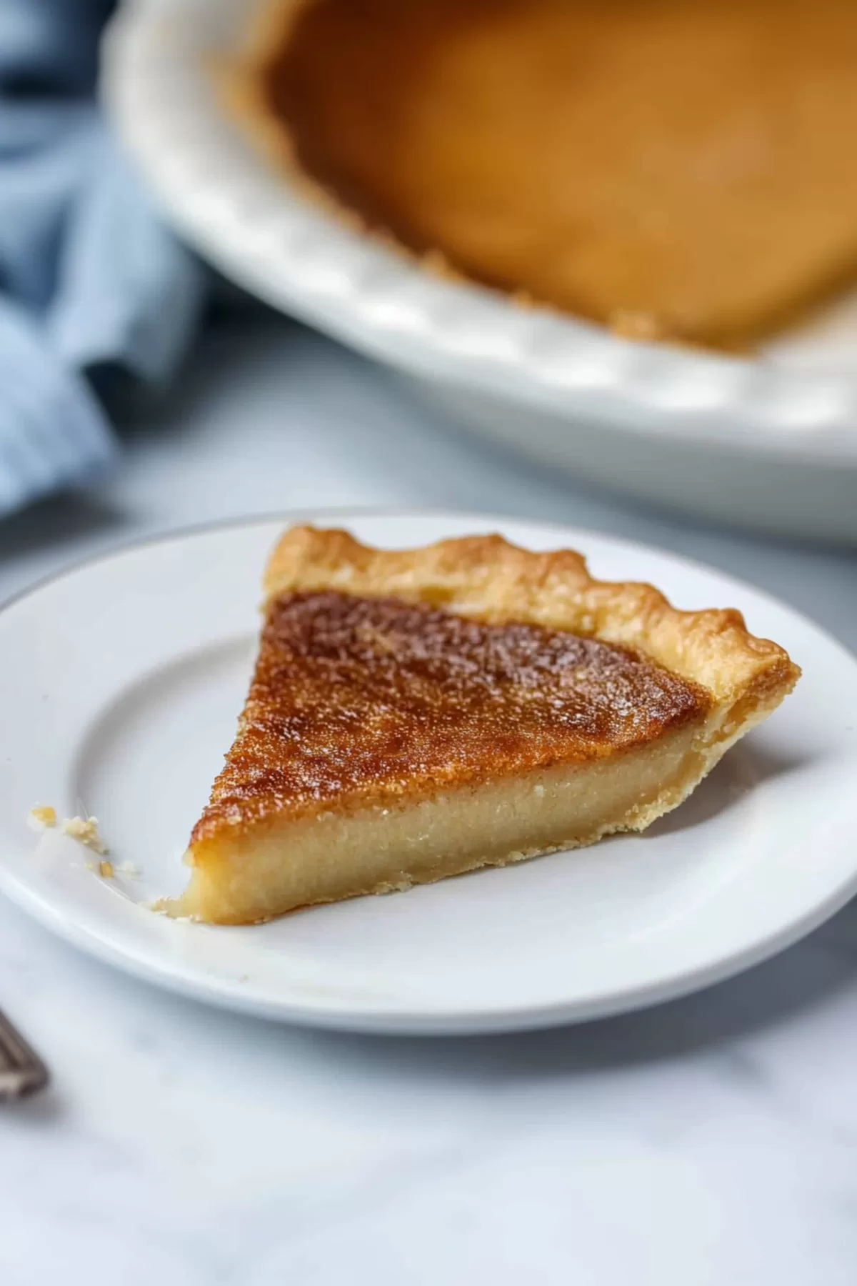 A rustic dessert slice with a glossy top, ready to be enjoyed.