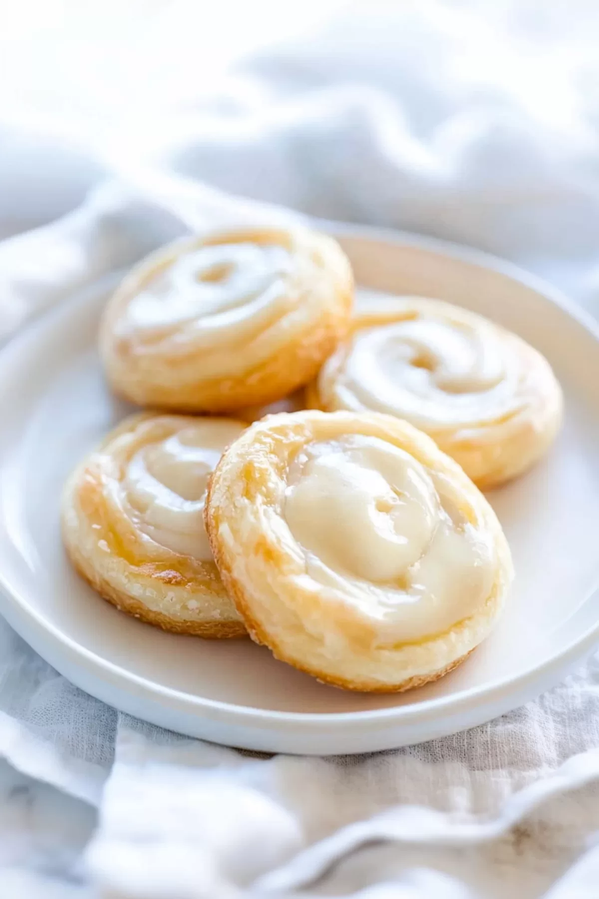 A plate of warm, flaky pastries perfect for breakfast or a sweet treat.