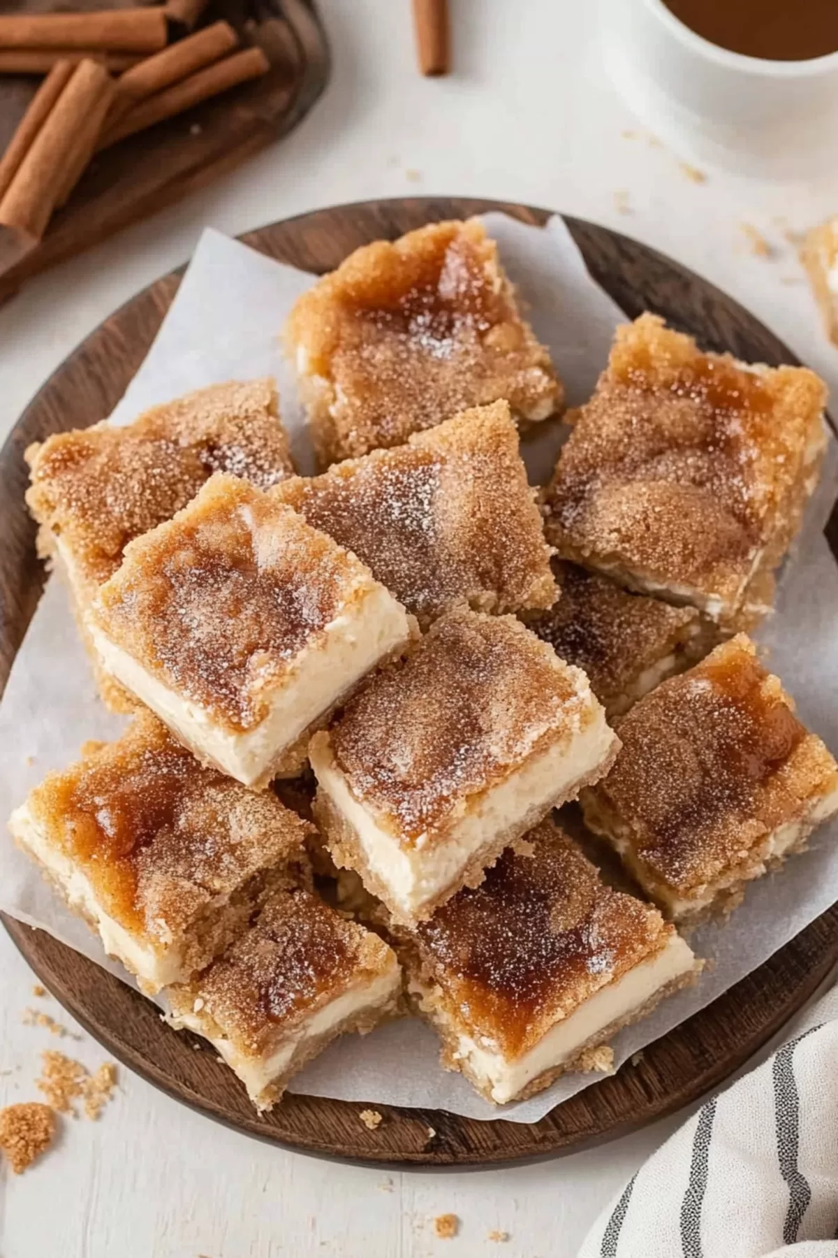 A plate of sweet bars dusted with a light sprinkle of cinnamon sugar.