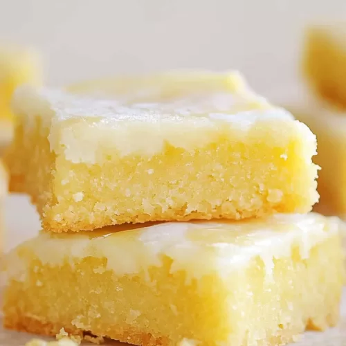 Freshly baked lemon bars with a soft, golden texture.