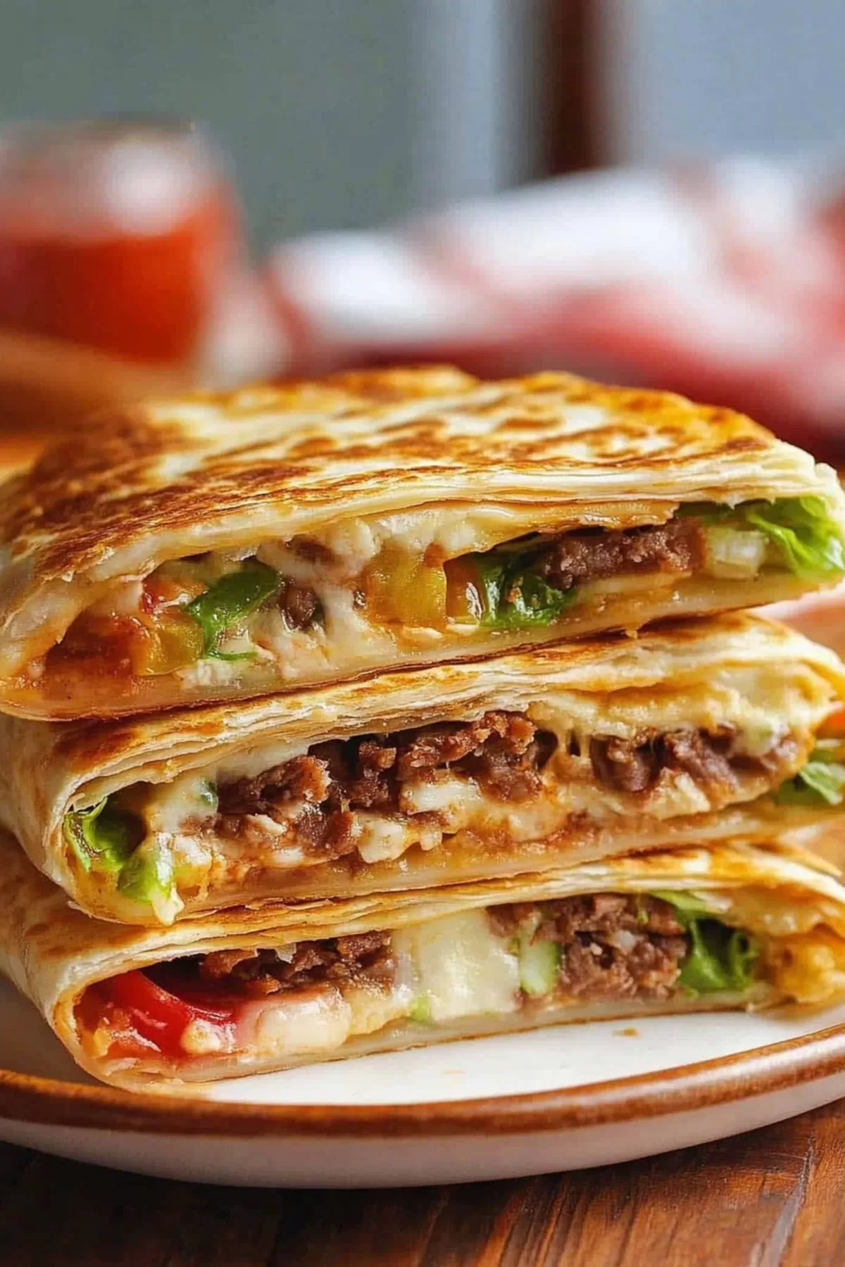 Golden folded tortilla stuffed with seasoned fillings, presented on a serving plate.