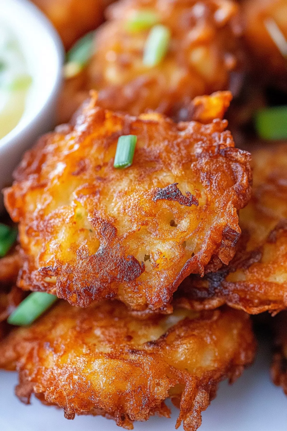 Close-up of crispy fritters with a perfectly fried, flaky texture.