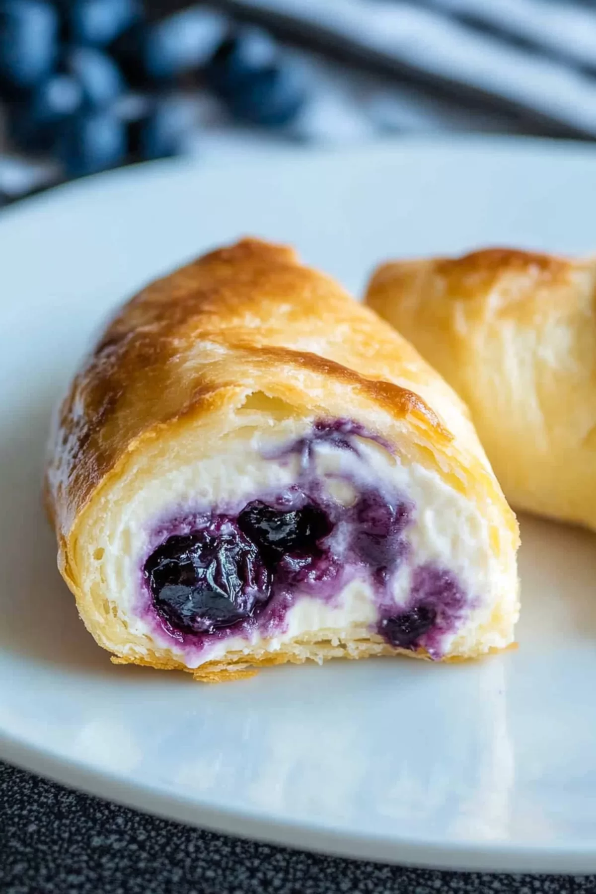 A platter of freshly baked rolls topped with a light glaze, perfect for a sweet treat.