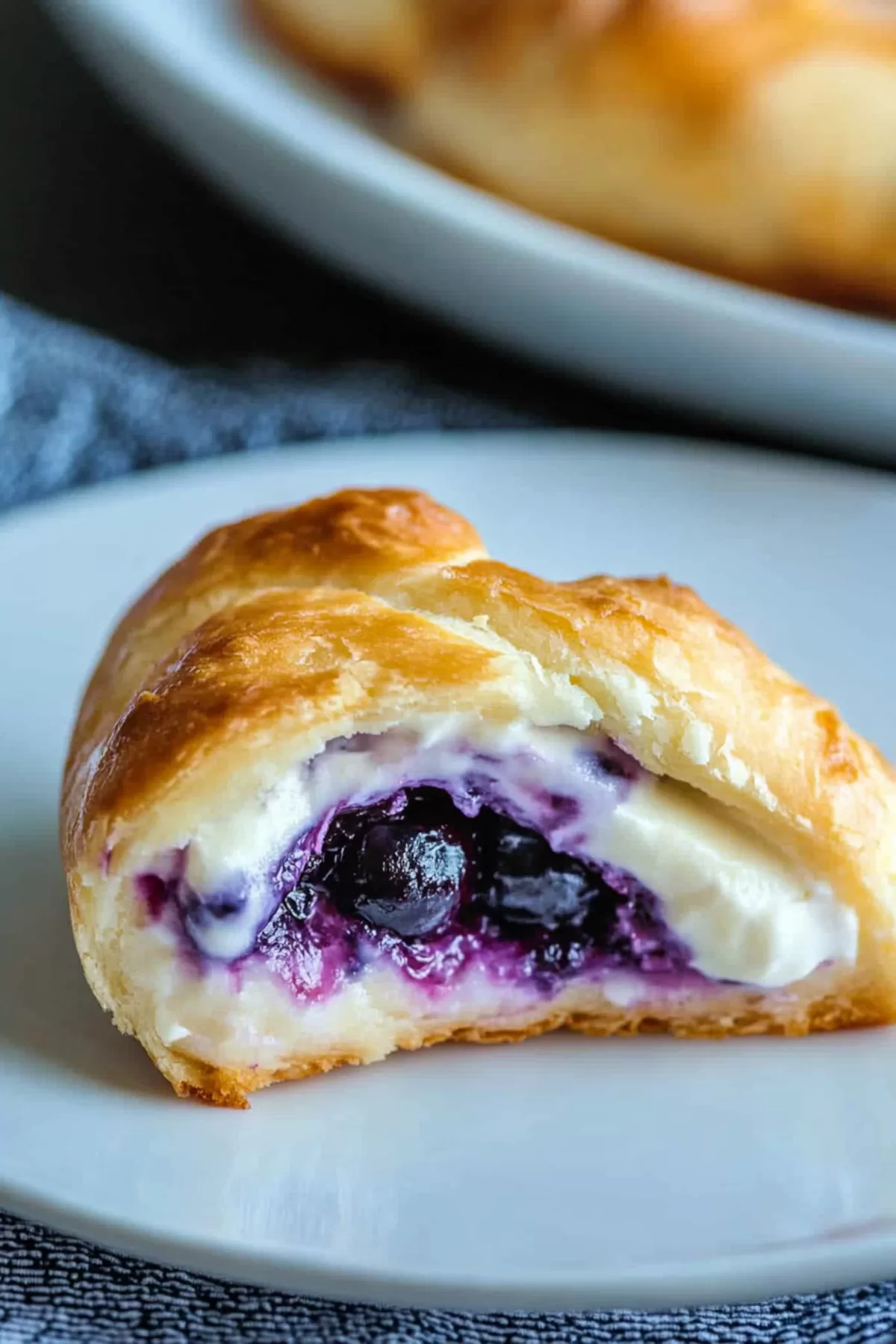 Fluffy pastry rolls with a rich, creamy filling, arranged beautifully on a serving dish.