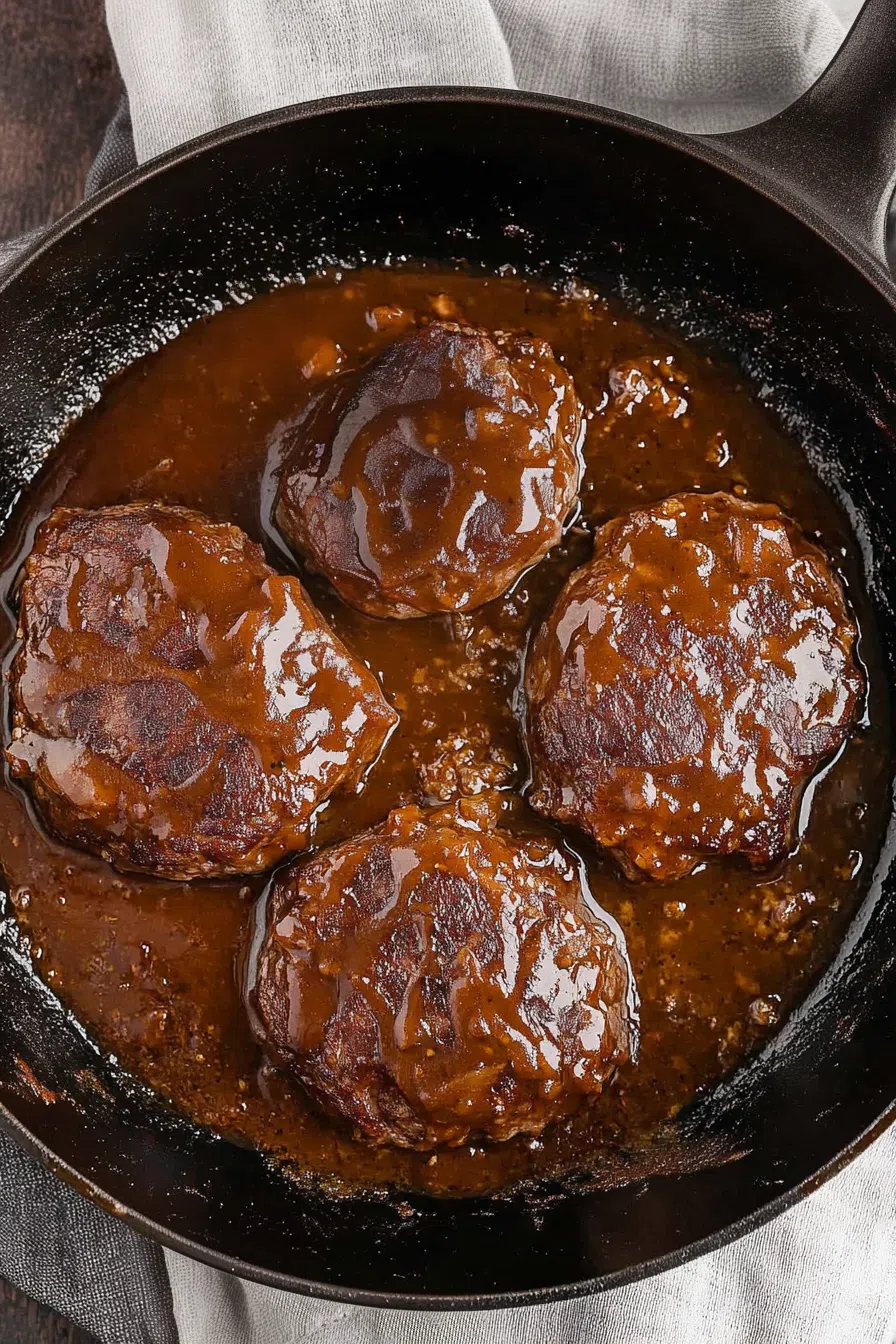 Golden-browned beef patties simmered in a flavorful onion and mushroom gravy.