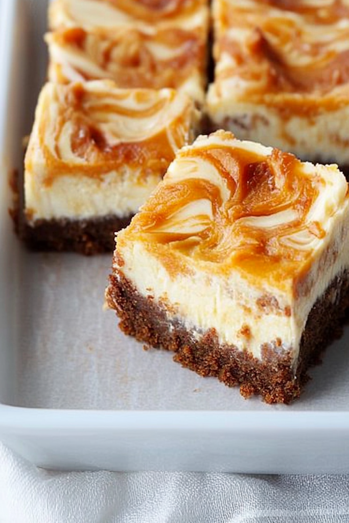 Neatly sliced bars with a soft, spiced base and rich topping.