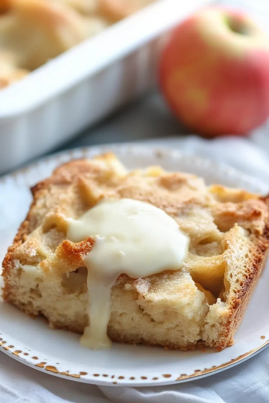 A top-down view of a dessert with a crispy crust and soft interior, garnished with a touch of cream.