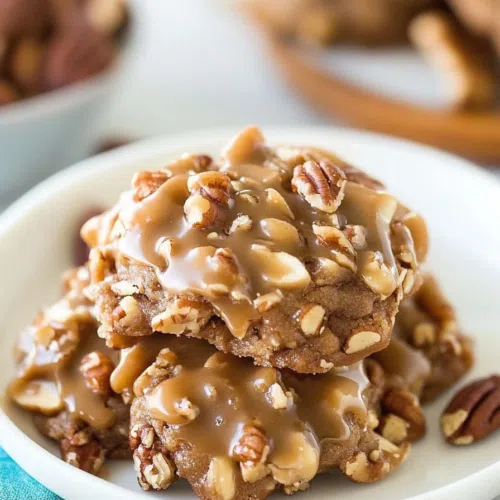 Close-up of a no-bake cookie showcasing its textured coconut and pecan layers.