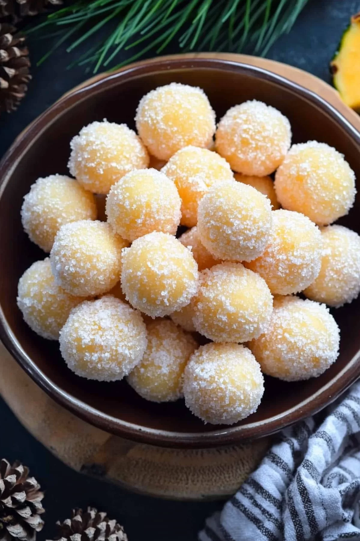 Festive dessert bites coated in shredded coconut, arranged on a holiday platter.