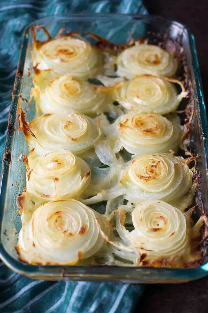 Golden-brown baked onion slices layered with melted cheese and savory seasoning.