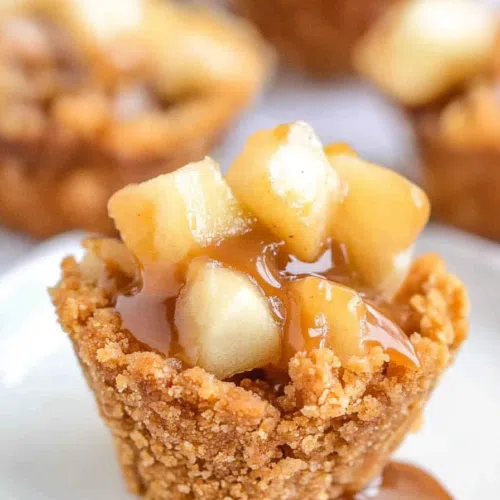Close-up of a perfectly baked apple bite, with a crispy texture on top.