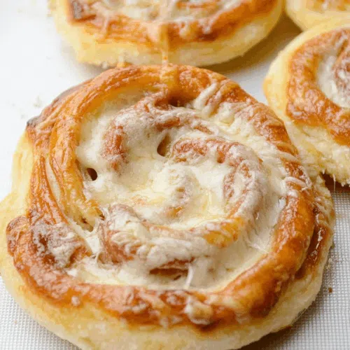 Close-up shot of puff pastry bites showing layered texture.