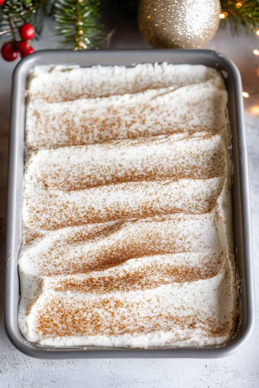 A beautifully frosted cake with a smooth, velvety texture and holiday spices.