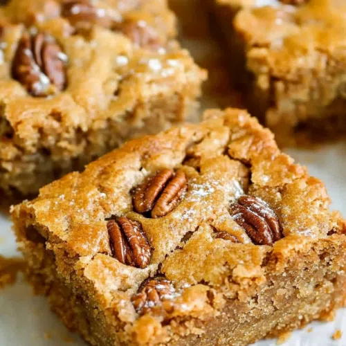 A freshly baked loaf with a crisp crust and pecan pieces peeking through.