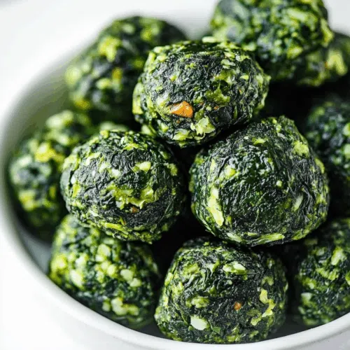 Close-up view of golden, crispy snack rounds with herbs.