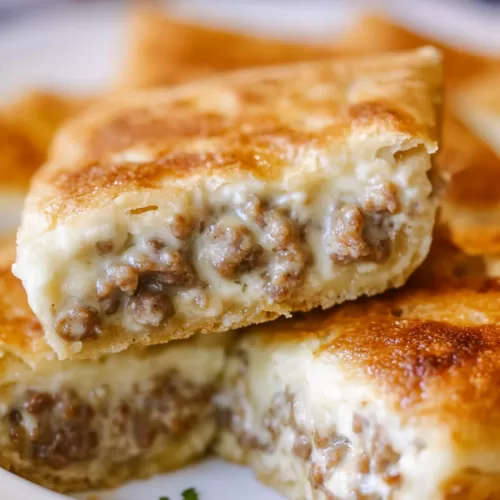 Layers of buttery pastry with a creamy, spiced sausage filling, perfect for brunch.