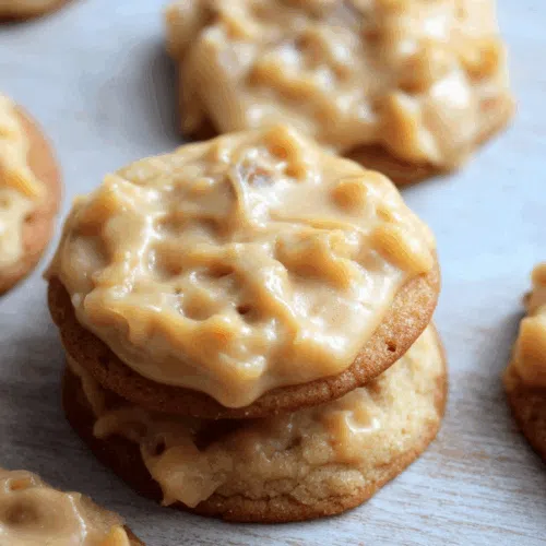 Close-up of soft, layered cookies filled with creamy frosting.
