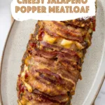 Bacon wrapped stuffed meatloaf with melted cheese and text overlay on image