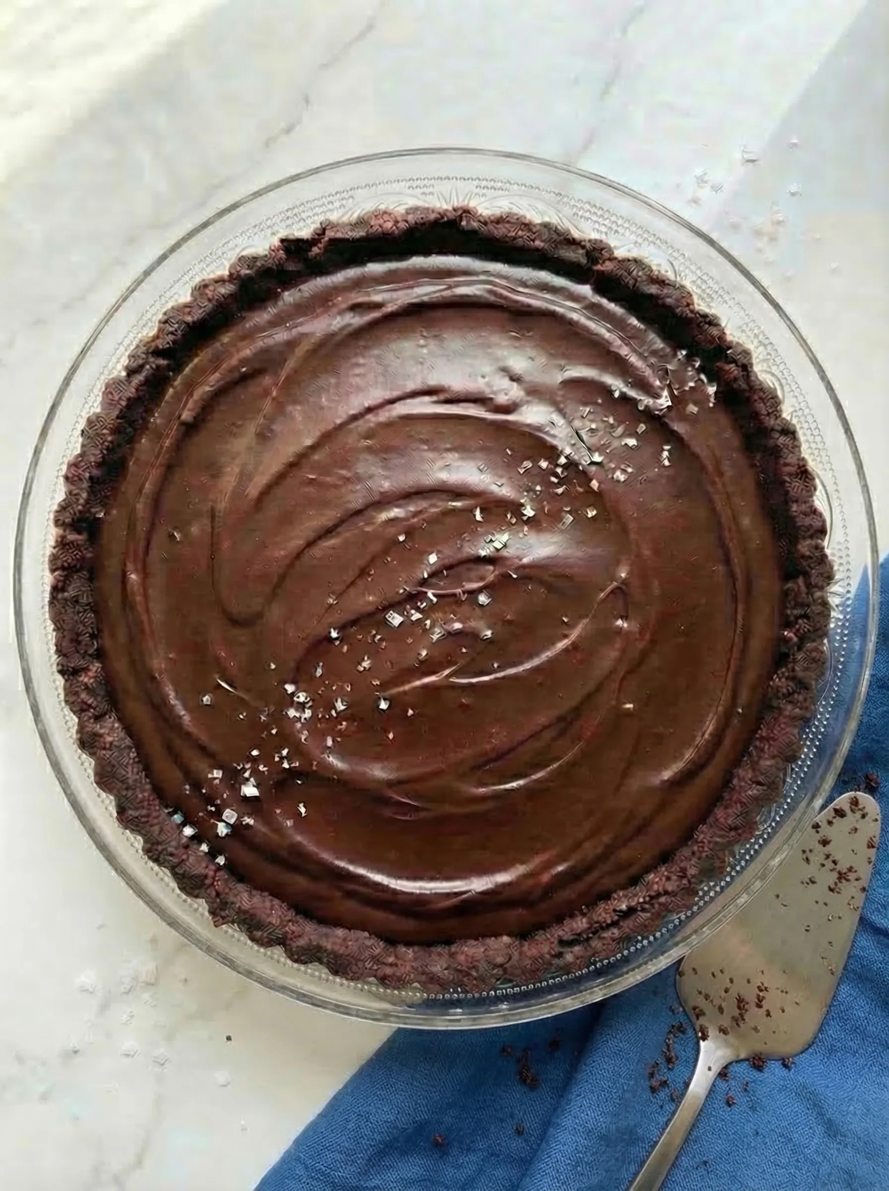 Chocolate Salted Caramel Tart with glossy chocolate ganache and flaky sea salt on top