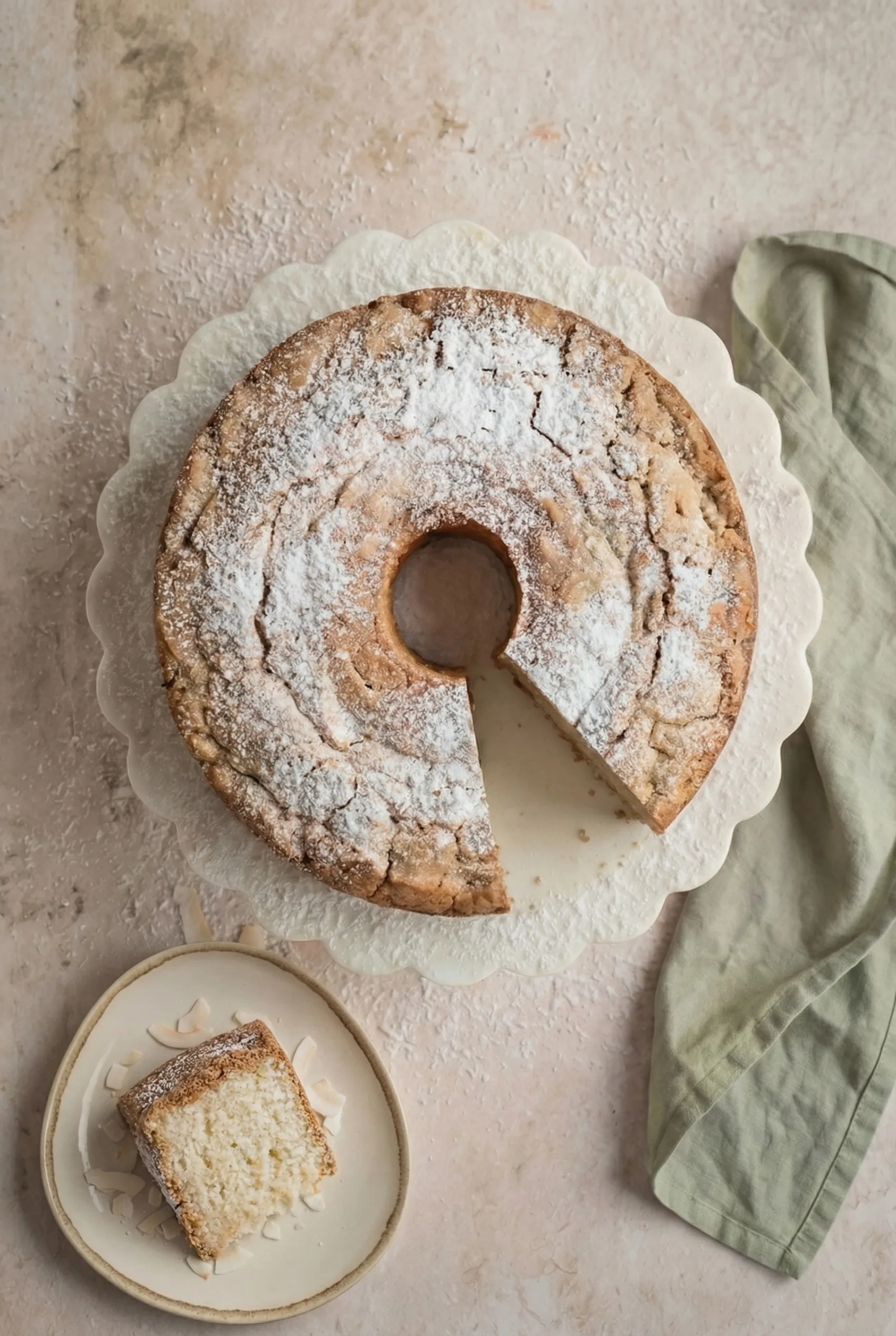 Coconut Cream Cheese Pound Cake with one slice removed showing moist fluffy interior