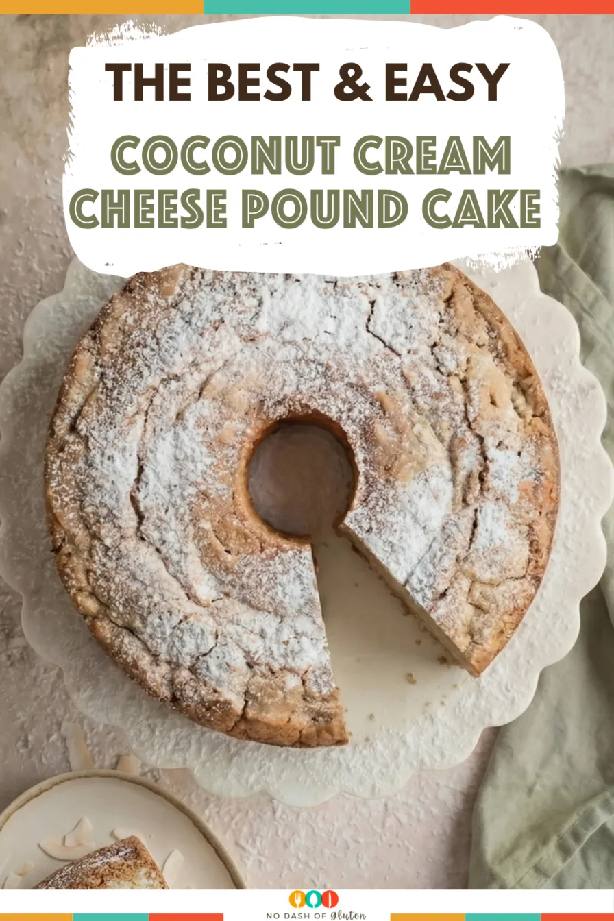 Coconut Cream Cheese Pound Cake topped with powdered sugar and sliced to show soft crumb