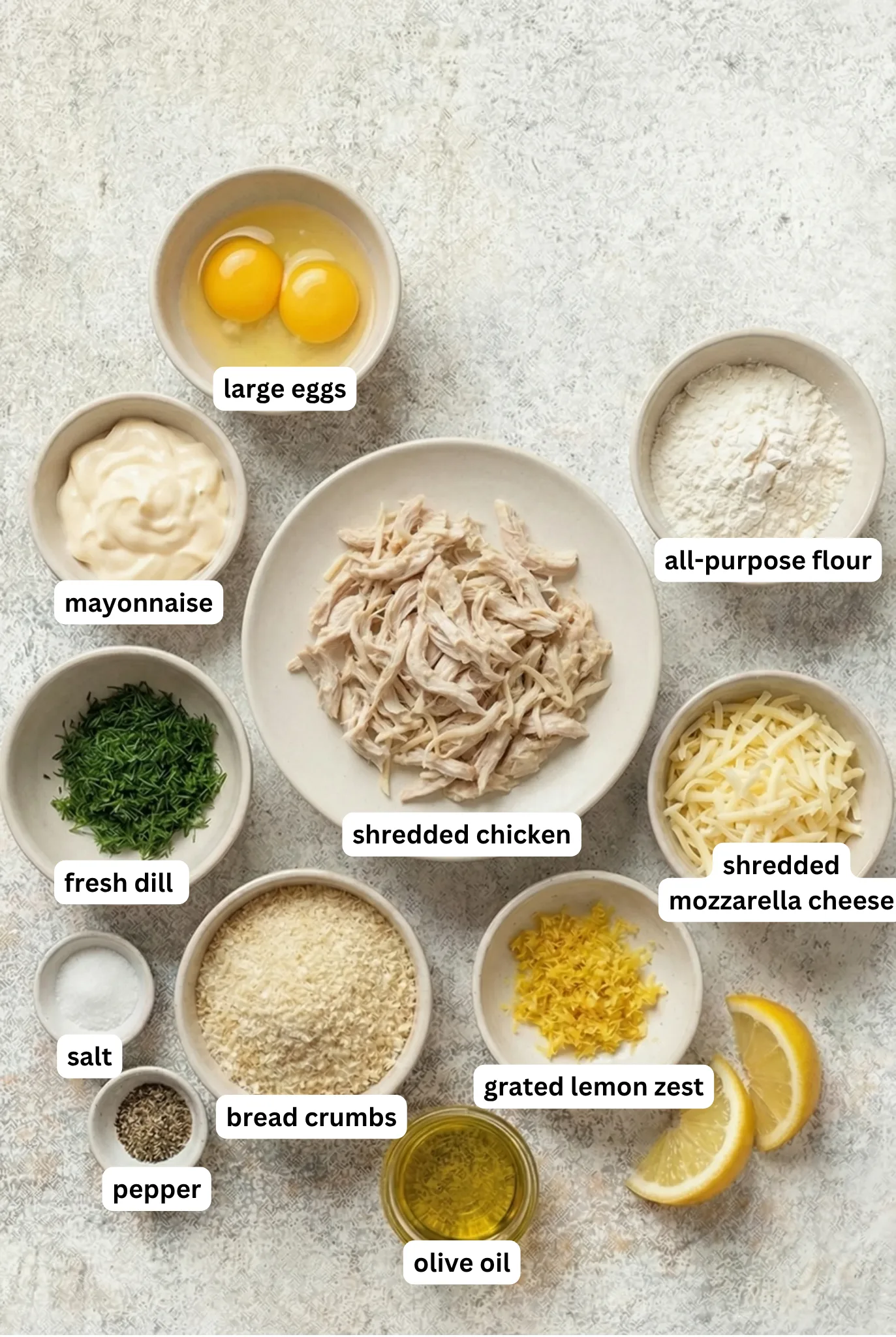 ingredients for Easy Chicken Patties including shredded chicken eggs mayonnaise dill breadcrumbs and cheese
