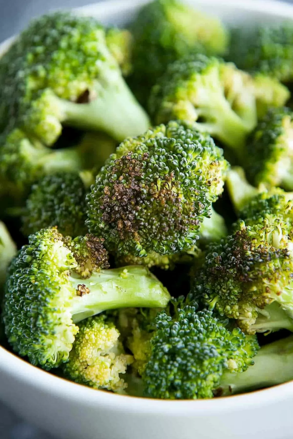 Florets arranged in a bowl, showcasing their vibrant green and crunchy texture.