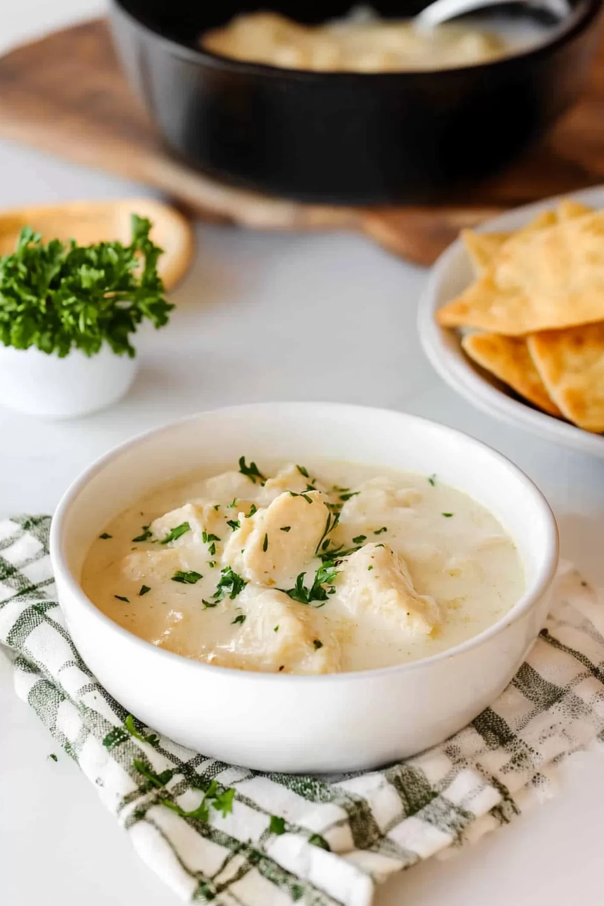 Warm, comforting dish of chicken and dumplings with a rich, creamy texture.