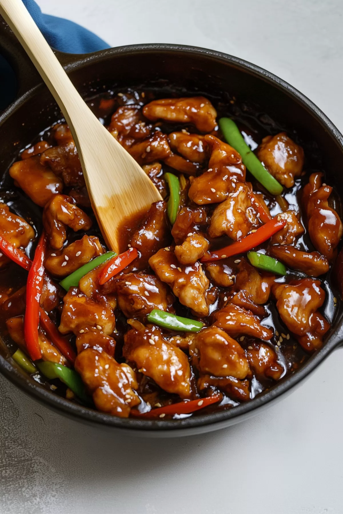 Delicious stir-fried chicken served with a side of steamed rice and sautéed vegetables