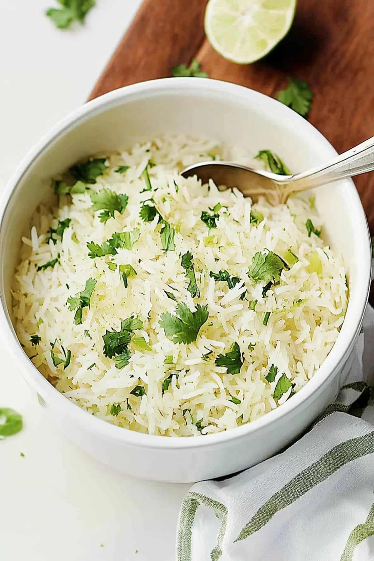 A spoonful of flavorful rice being served, highlighting its light and fluffy texture.