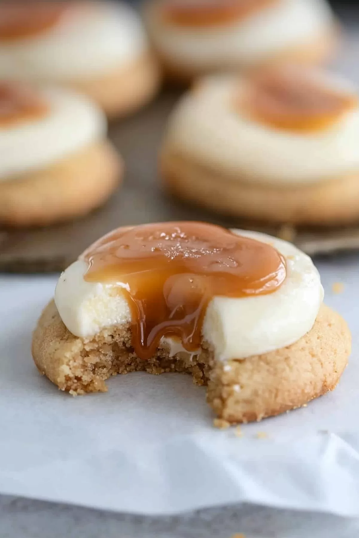 Soft, golden cookies topped with rich cheesecake filling and a caramel glaze.