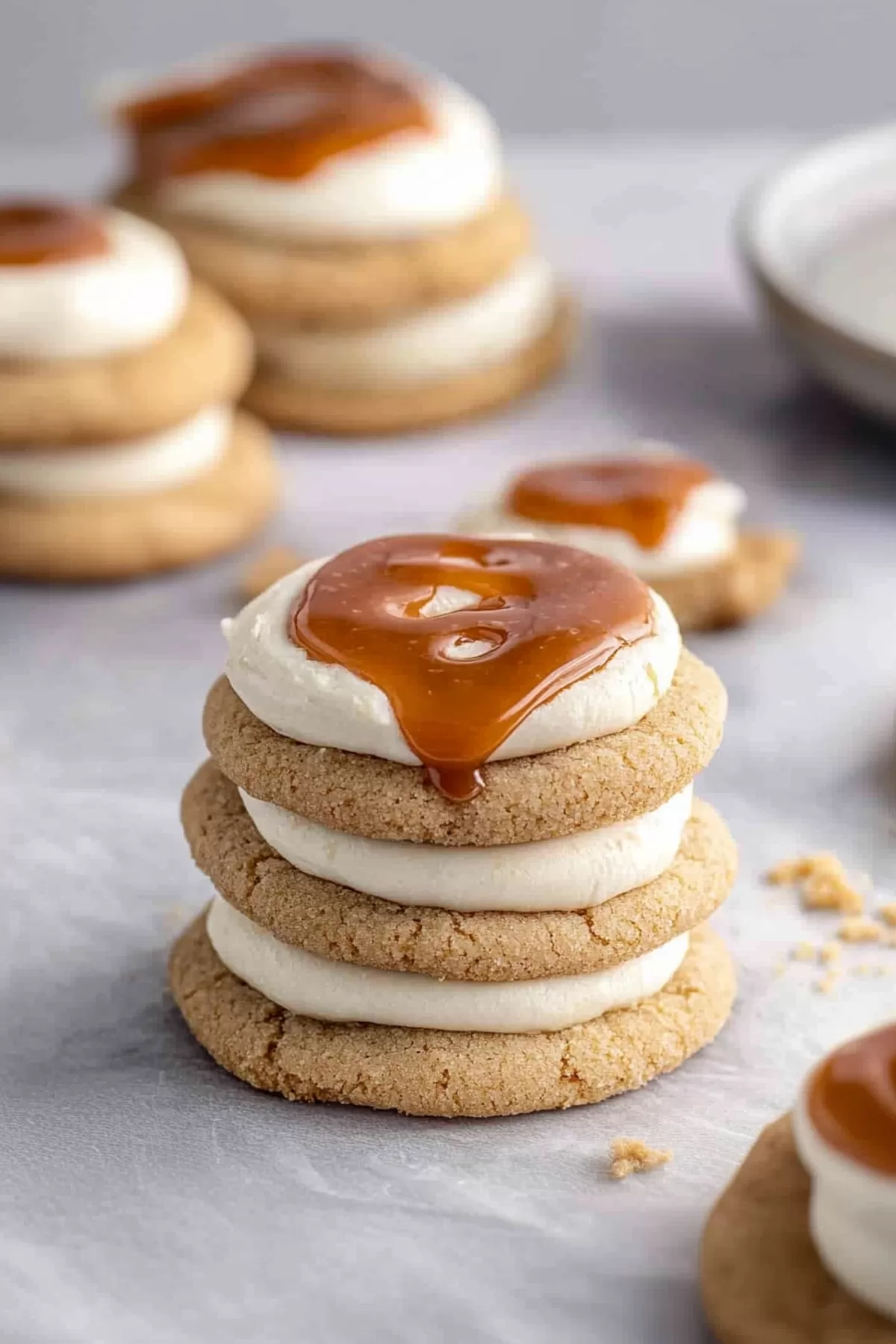 A bite-sized cookie showing the soft interior and luxurious caramel topping.