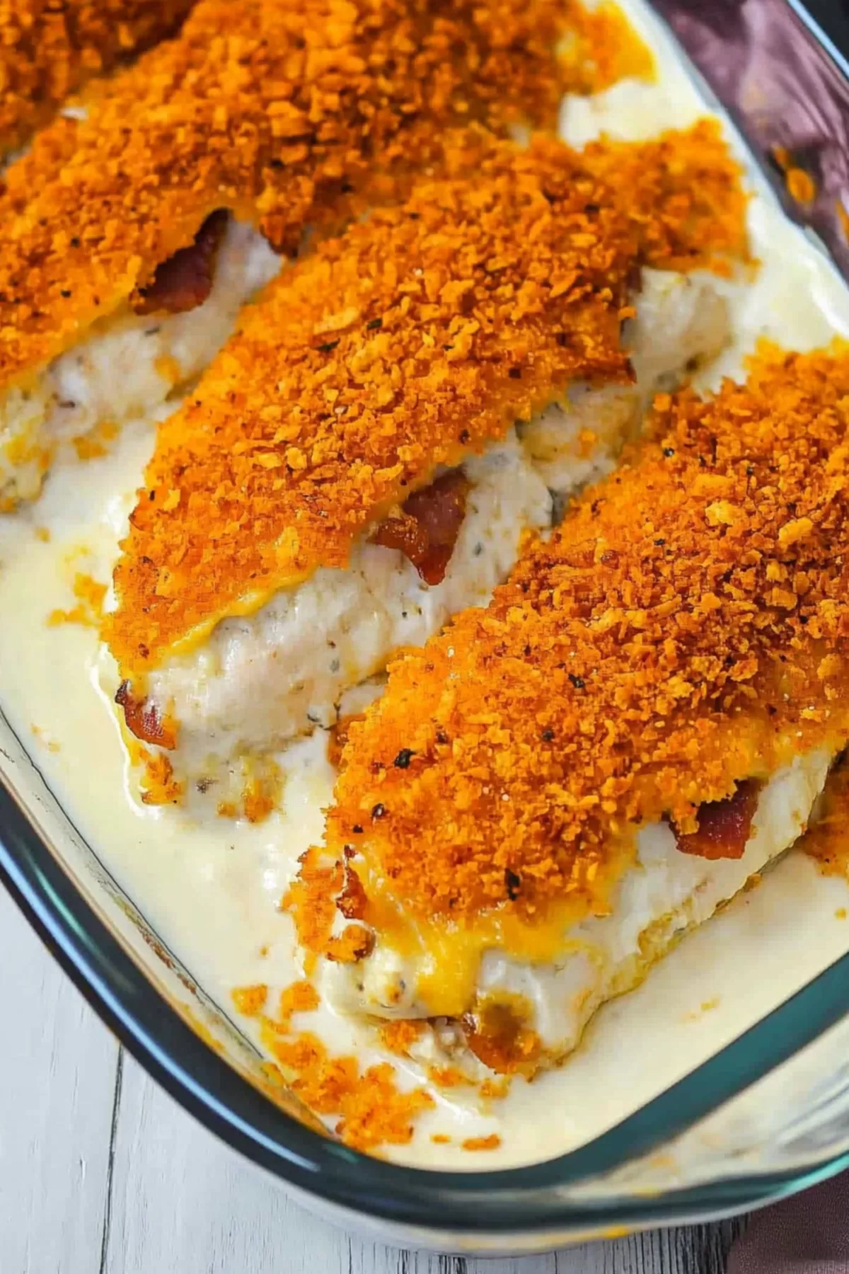 A serving of stuffed chicken with a crunchy coating and a rich, savory filling.