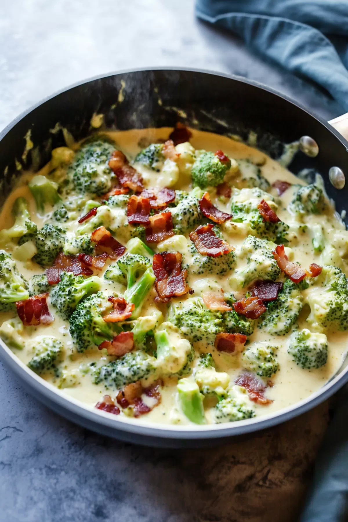 Lush broccoli florets and crispy bacon pieces in a decadent creamy sauce, served warm.