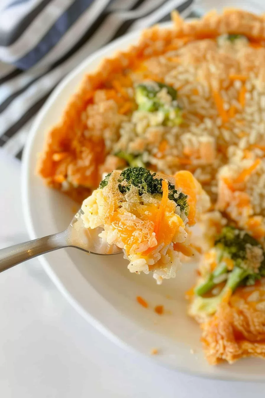 Close-up of the pie’s texture, revealing layers of rice, cheese, and broccoli.