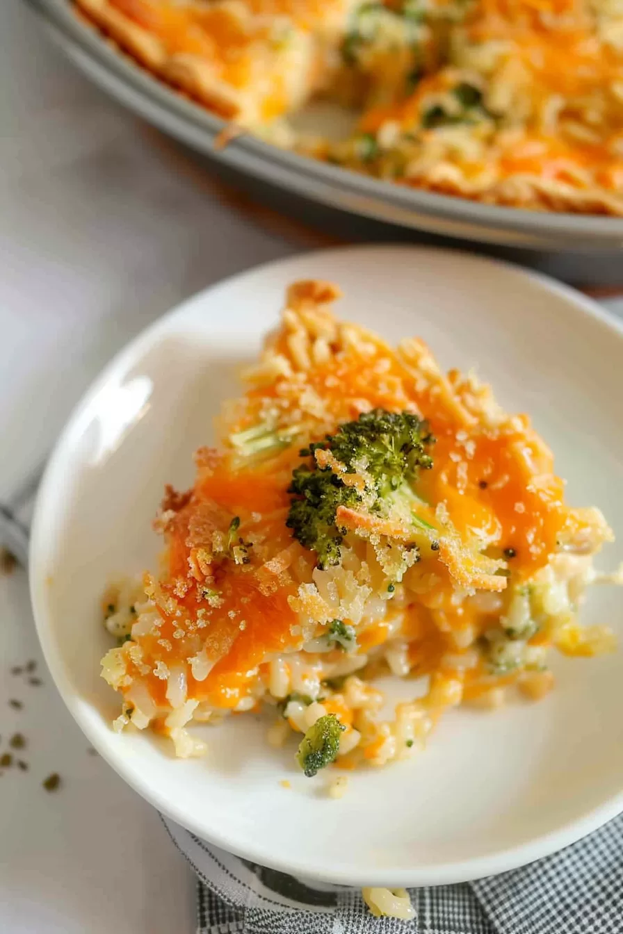 Individual servings of broccoli rice pie on a plate, garnished with fresh herbs.