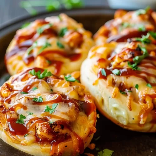 Close-up of crispy, bite-sized rolls with a BBQ-style filling.