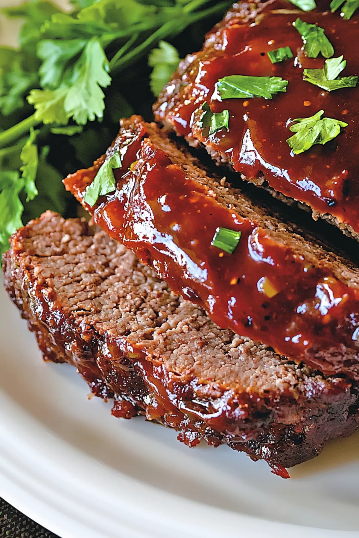 A comforting slice of meatloaf with a savory onion soup flavor, perfect for dinner.