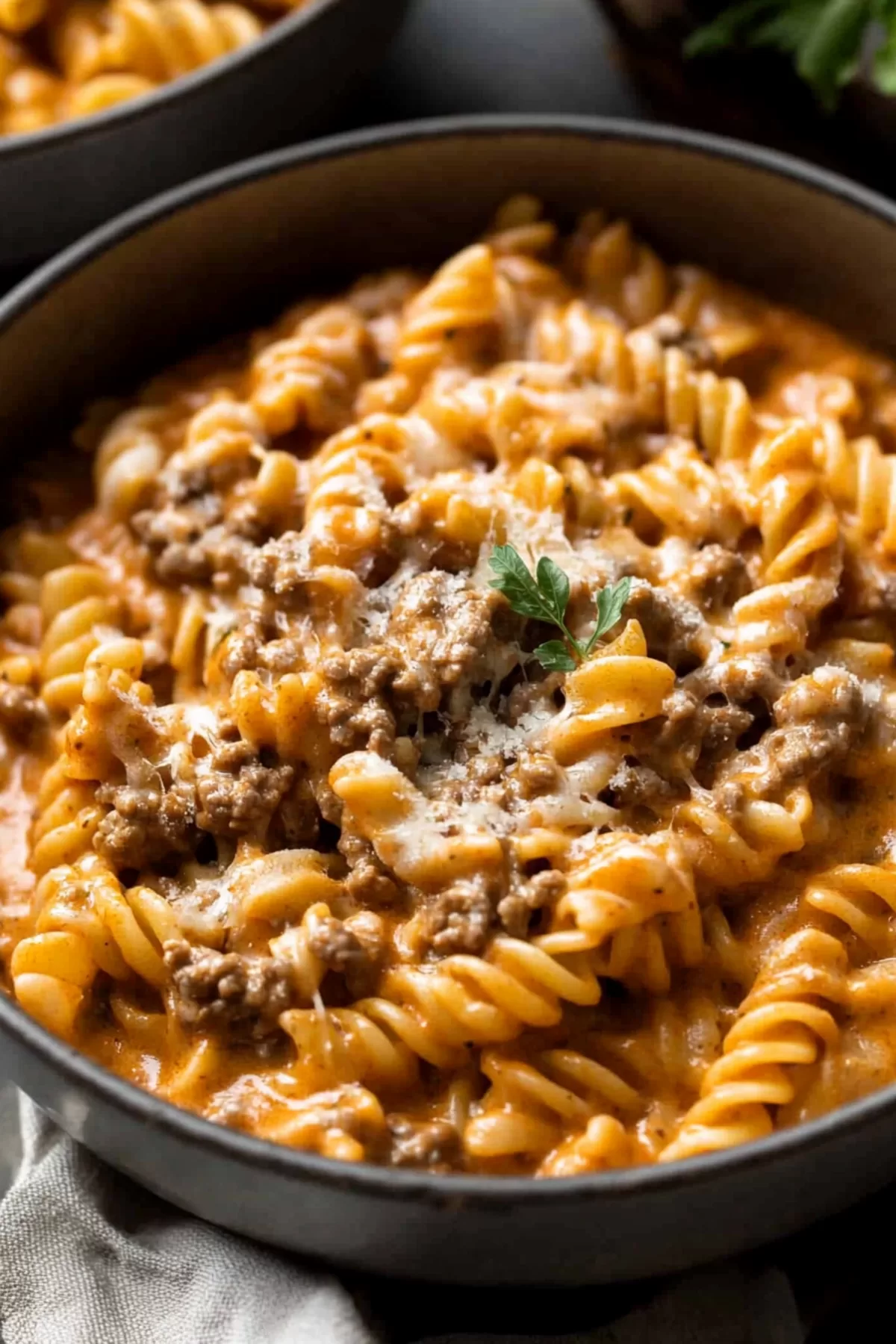 A hearty pot of pasta with ground beef and a velvety sauce, perfect for a comforting family meal.