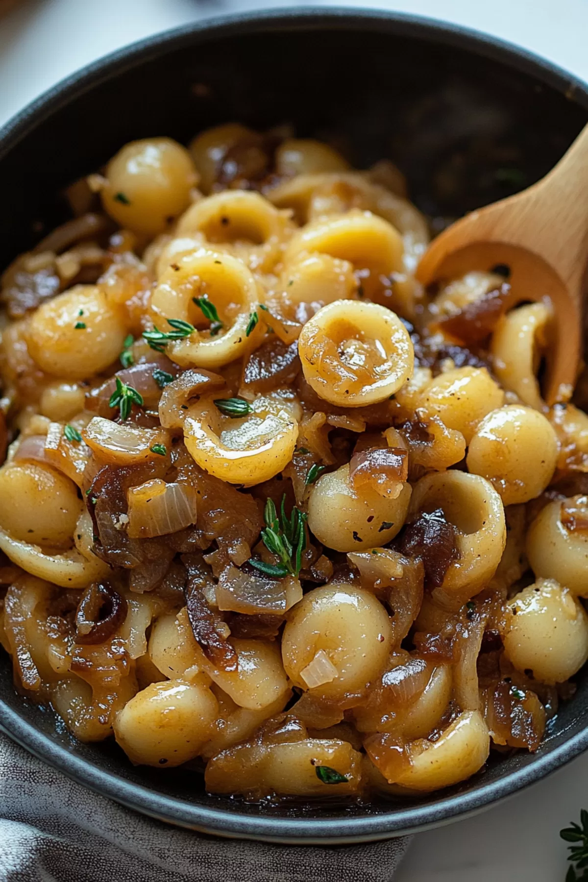 A fork twirling a portion of the pasta, showing its gooey, cheesy texture.