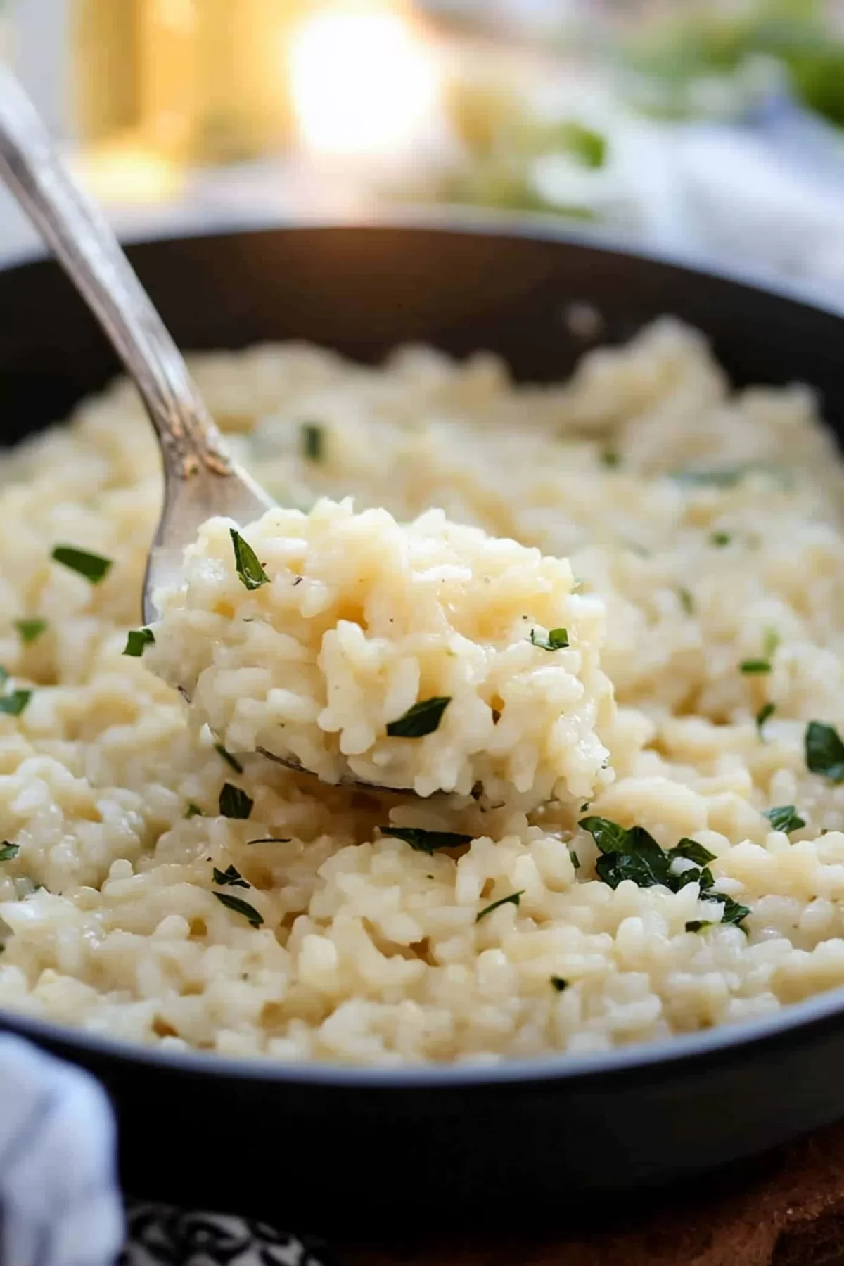 A bowl of risotto with a perfect consistency, sprinkled with parsley for a fresh finish.