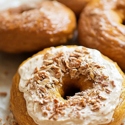 Pumpkin spice bagel with a smooth spread, sprinkled with a hint of cinnamon spice