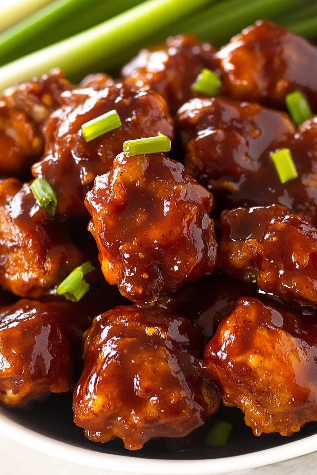 Close-up of juicy chicken bites with a perfect balance of crispy coating and rich glaze.