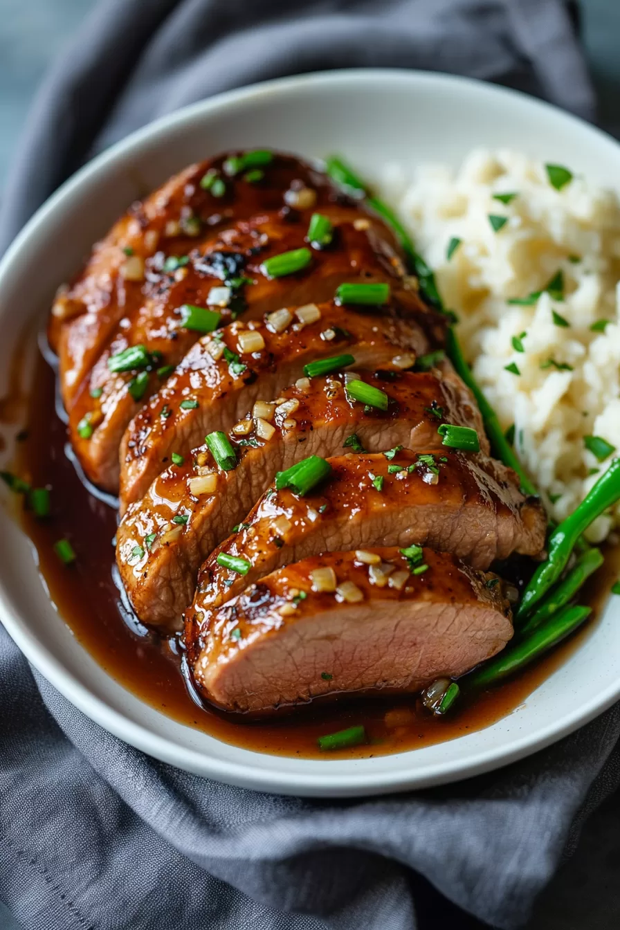 Juicy pork tenderloin drizzled with honey garlic sauce.