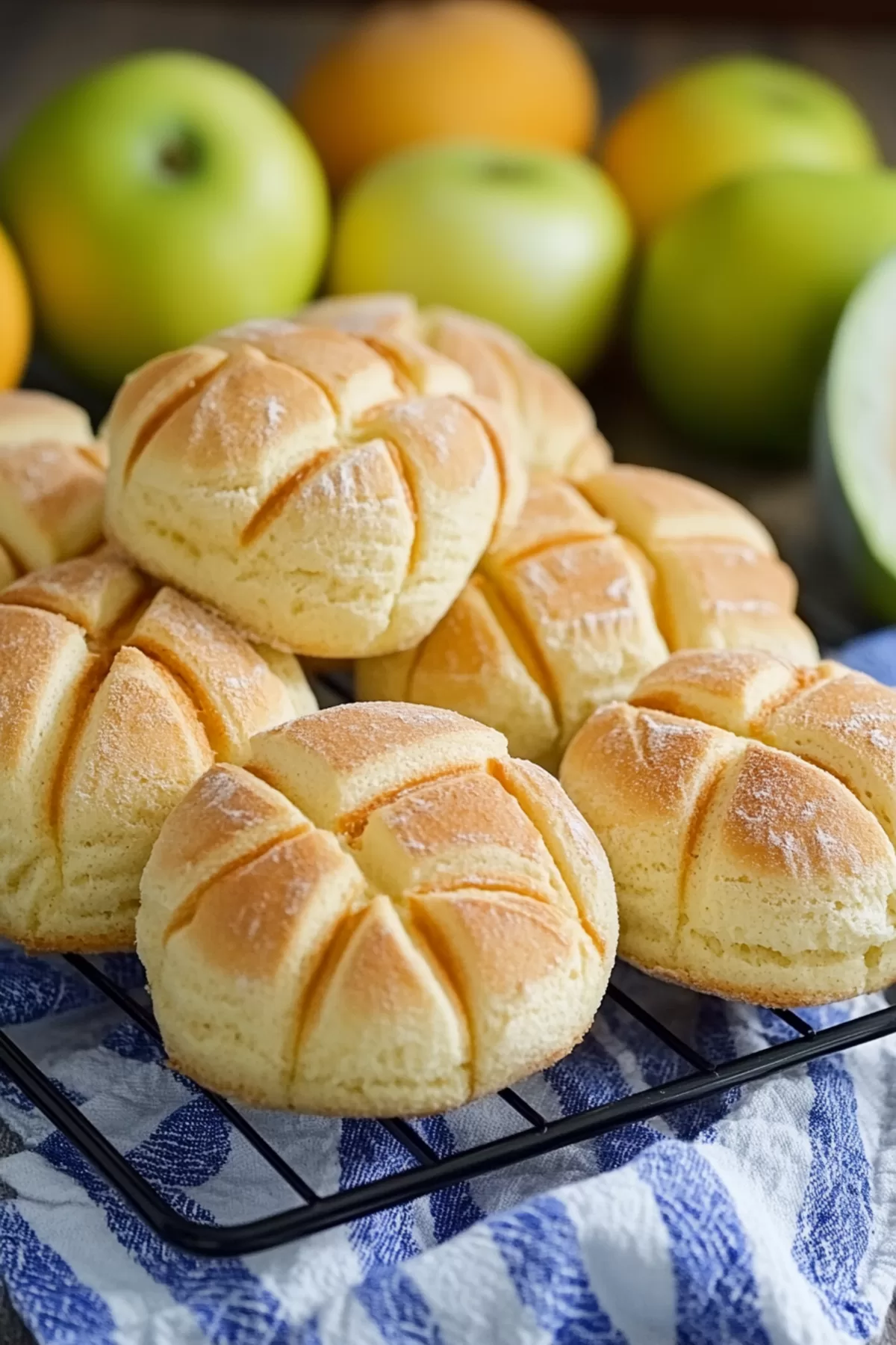 A stack of sweet, crackled buns, showcasing their crisp texture and fluffy inside.