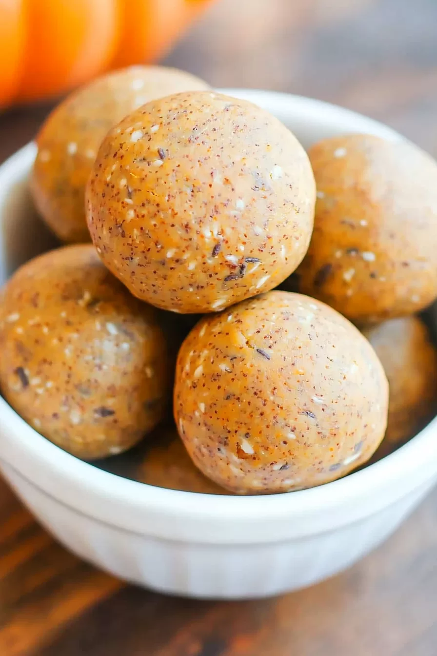 Close-up of pumpkin-spiced energy balls in a bowl.