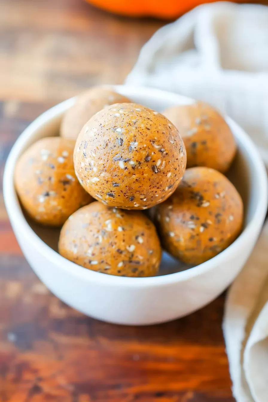 Healthy snack balls with oats and fall spices in a small bowl.