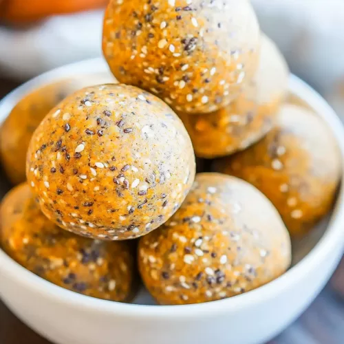 Pumpkin spice snack bites topped with a light dusting of cinnamon.